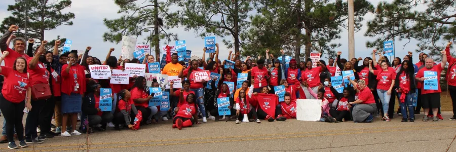 Maximus workers take a group photo while on strike